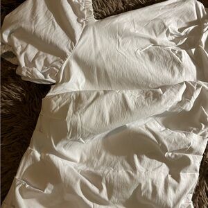 Brand new Anthropologie white puffed sleeve dress.